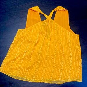 FRAME Size Large in a light silk peach flowy top. Has polyester orange lining.